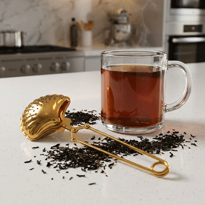 Images en rafalles de l'infuseur a thé | pince-moi coquillage doré